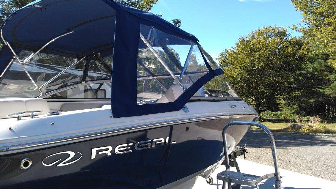 Custom marine canvas enclosure on a Regal boat